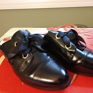 Women's slide on nine west side 9 1/2. Black man made upper 1" heel.